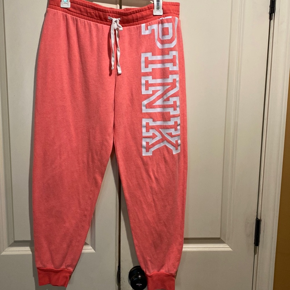 Gently used pink  2 piece jogger suit sold together only. Color is coral